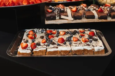 Dessert squares and cheesecake bites topped with berries