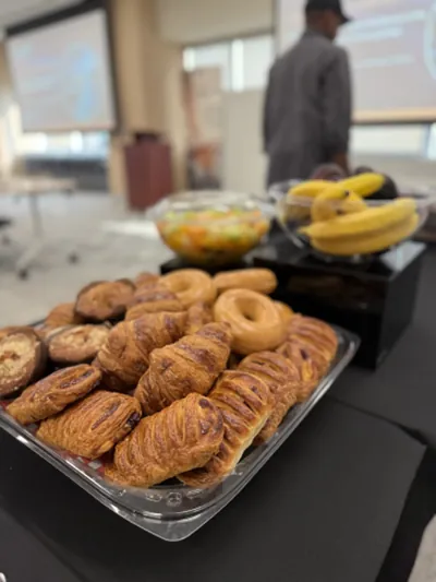 Trays of fresh pastries, bread rolls and fried plantain
